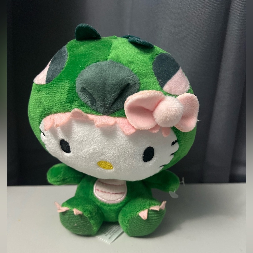 Sanrio Hello Kitty plush toy in a green dragon costume
